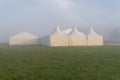 Marquees in the morning mist.