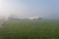 Marquees in the morning mist.