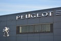 Peugeot sign, logo, symbol on the facade of Peugeot PSA Retail Warsaw