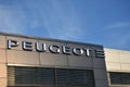 Peugeot sign, logo, symbol on the facade of Peugeot PSA Retail Warszawa