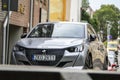 Peugeot 208 silver hatchback car on a streets of Koszalin in Poland Royalty Free Stock Photo