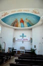 Pews pulpit statues and Jesus ceiling art Catholic Church of Holy Spirit Batumi Georgia