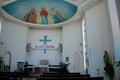 Pews pulpit statues and Jesus ceiling art Catholic Church of Holy Spirit Batumi Georgia Royalty Free Stock Photo