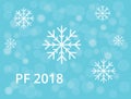 PF 2018 with snowflake and blue bokeh snow and rings background Royalty Free Stock Photo