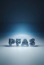 PFAS sign on a blue background - crashing in a small particles conceptual 3D render