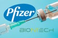Pfizer and BioNTech logos on blue background, Covid19 vaccine vial and syringe, Coronavirus immunization