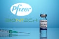 Pfizer and BioNTech Vaccine Logo with Covid Inoculation Vial and Syringe