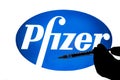 Pfizer logo with hypodermic needle Royalty Free Stock Photo