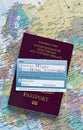 Pfizer vaccine card on UK passport Royalty Free Stock Photo