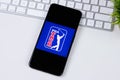 PGA TOUR app logo on a smartphone screen. Royalty Free Stock Photo