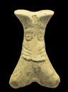 Phalanx bone idol with face depicted