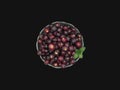 Phalsa falsa in a bowl of glass with mint leaves.Isolated on black background top view Royalty Free Stock Photo