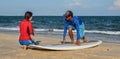 Surf school students training on beach