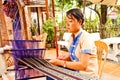 Phan Thiet, Vietnam - NOVEMBER 06, 2011: Woman weaving cloth. Authentic loom.