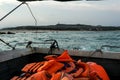 Seascape with horizon line and rocks tonight, boat view.