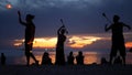 PHANGAN, THAILAND - 23 MARCH 2019 Zen Beach. Silhouettes of performers on beach during sunset. Silhouettes of young anonymous