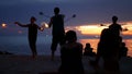 PHANGAN, THAILAND - 23 MARCH 2019 Zen Beach. Silhouettes of performers on beach during sunset. Silhouettes of young anonymous