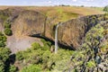 Phantom Waterfall dropping off over vertical basalt walls, North Table Mountain Ecological Reserve, Oroville, California