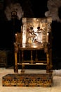 Replica pharaoh golden chair throne inside indoors, closeup pretty nice rich