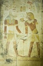 Pharaoh Seti offering to Anubis