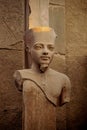 Pharaoh statue in the ancient ruins of the Temple of Karnak in Luxor, Thebes, Egypt Royalty Free Stock Photo