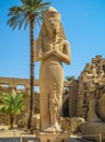 Pharaoh statue in anscient Temple of Karnak in Luxor - Ruined Thebes Egypt