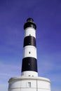 Phare de Chassiron in Island D`Oleron in French Charente with stripedwhite black lighthouse in blue sky France