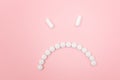 Pharma Harm. Angry Smiley Face Made from White Pills