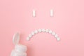 Pharma Harm. Sad Smiley Face Made from White Pills