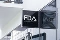 Wall of Pharma company showing on Square sign light board l FDA Registered Facility. approved