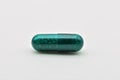 Transparent green pills