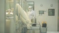 Pharmaceutical industry. Male factory worker inspecting quality of pills packaging in pharmaceutical factory. Automatic