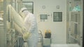 Pharmaceutical industry. Male factory worker inspecting quality of pills packaging in pharmaceutical factory. Automatic