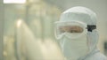 Pharmaceutical industry. Male factory worker inspecting quality of pills packaging in pharmaceutical factory. Automatic