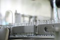Pharmaceutical industry. Production Line. Machine conveyor with glass bottles, ampoules in a factory. Fill bottles and Royalty Free Stock Photo