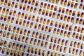 Pharmaceutical industry. Red-yellow capsule pills in blister pack. Pharmaceutical packaging. Pharmacy product. Global healthcare.