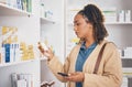 Pharmaceutical, medication and female customer choosing healthcare products or drugs in a drugstore. Dispensary, medical Royalty Free Stock Photo