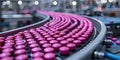 Pharmaceutical production line with pink tablets on conveyor belt in a modern manufacturing facility Royalty Free Stock Photo