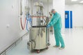 Pharmaceutical factory man worker in protective clothing working with control panel in sterile working conditions Royalty Free Stock Photo