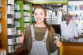 Pharmaceutist helping adult girl in drugstore Royalty Free Stock Photo