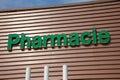 pharmacie lighting logo sign text in french means on wall building shop pharmacy facade Royalty Free Stock Photo