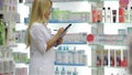 Pharmacist accounting the product in drugstore