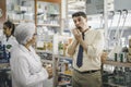 pharmacist is asking about a patient's condition in order to prescribe medication according to the patient's