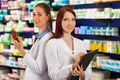 Pharmacist with assistant in pharmacy Royalty Free Stock Photo
