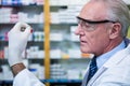 Pharmacist checking a capsule