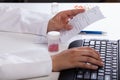 Pharmacist checking information about medicines Royalty Free Stock Photo