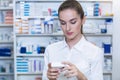 Pharmacist checking a medicine box