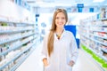 Pharmacist chemist woman standing in pharmacy