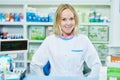 Pharmacist chemist woman working in pharmacy drugstore Royalty Free Stock Photo