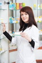 Pharmacist chemist woman working in pharmacy drugstore Royalty Free Stock Photo